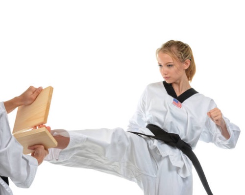 girl breaking a board